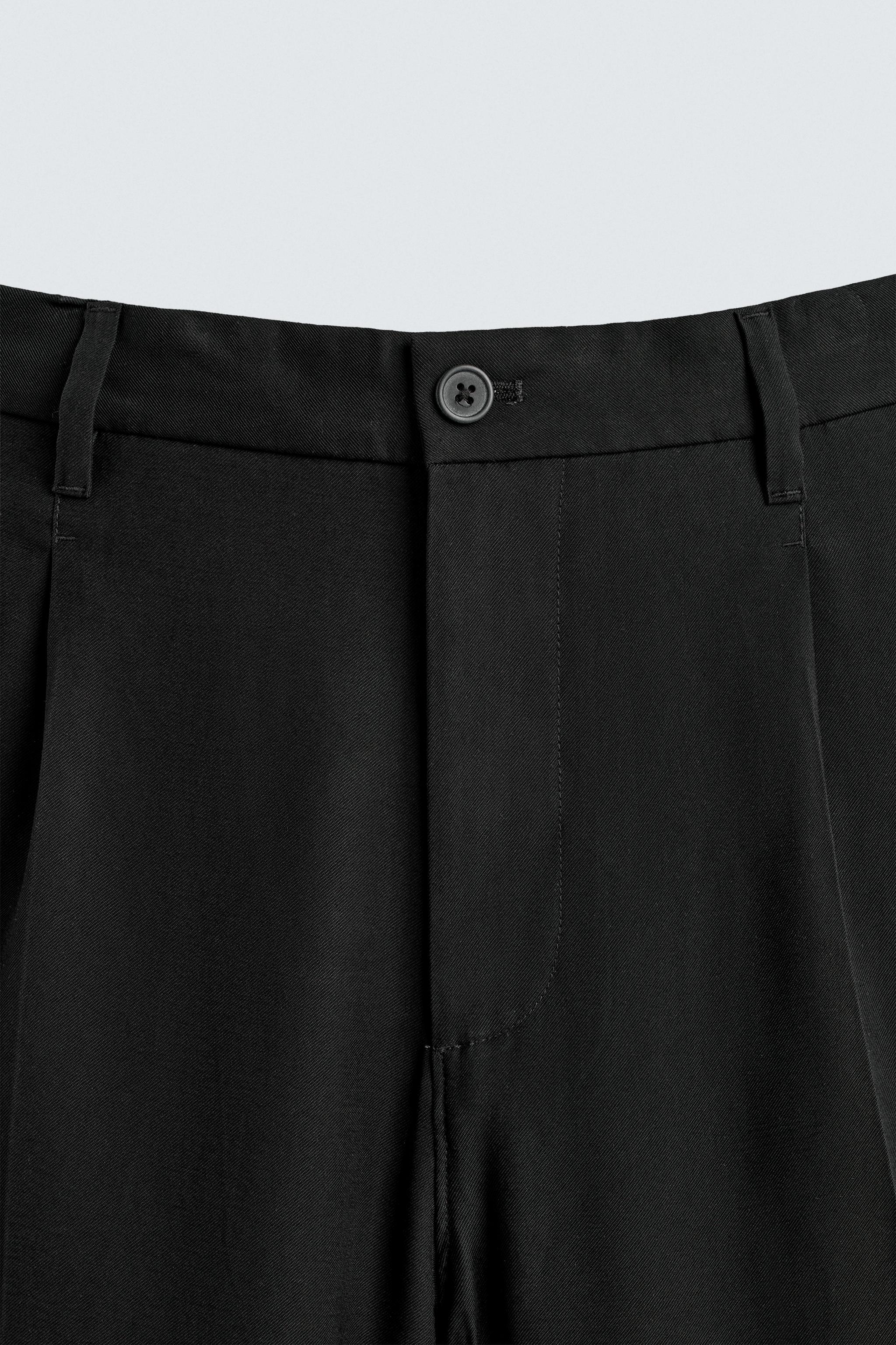 FLOWY RELAXED FIT PLEATED PANTS